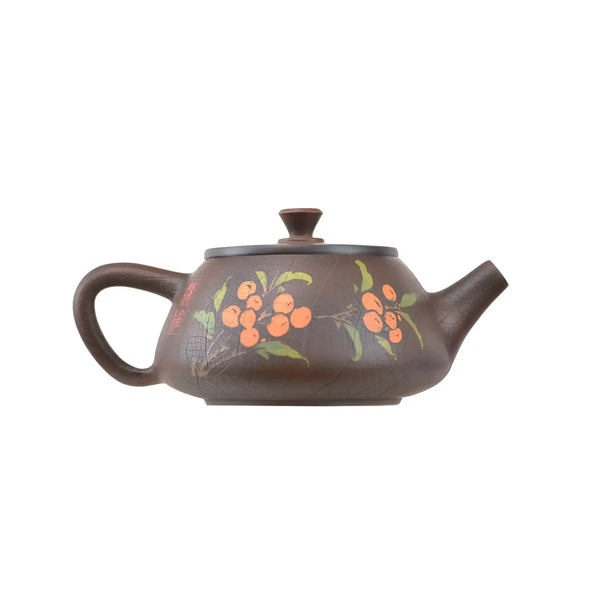 Bronze clay teapot with hand-carved floral and berry design, rounded body, side handle, and spout.