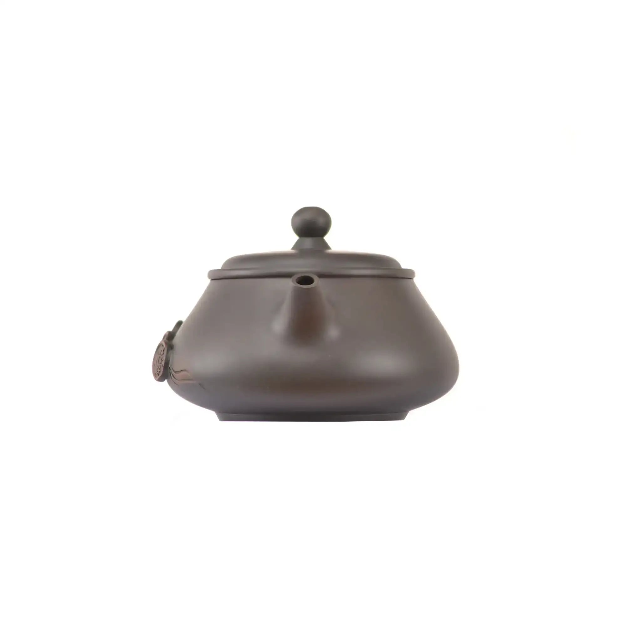 Handcrafted clay teapot No.15 featuring coin relief detailing and unglazed finish
