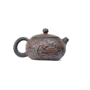 Side view of clay teapot No.30 showing detailed full lotus carving decoration