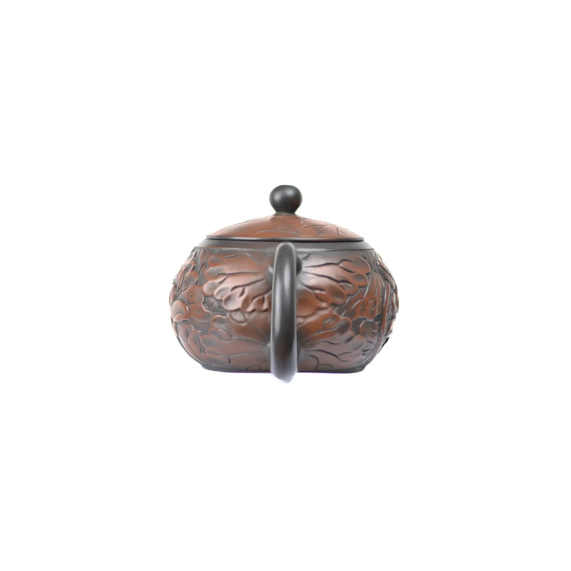 Back view of clay teapot No.31 highlighting carved lotus decoration style 2