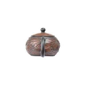 Back view of clay teapot No.31 highlighting carved lotus decoration style 2