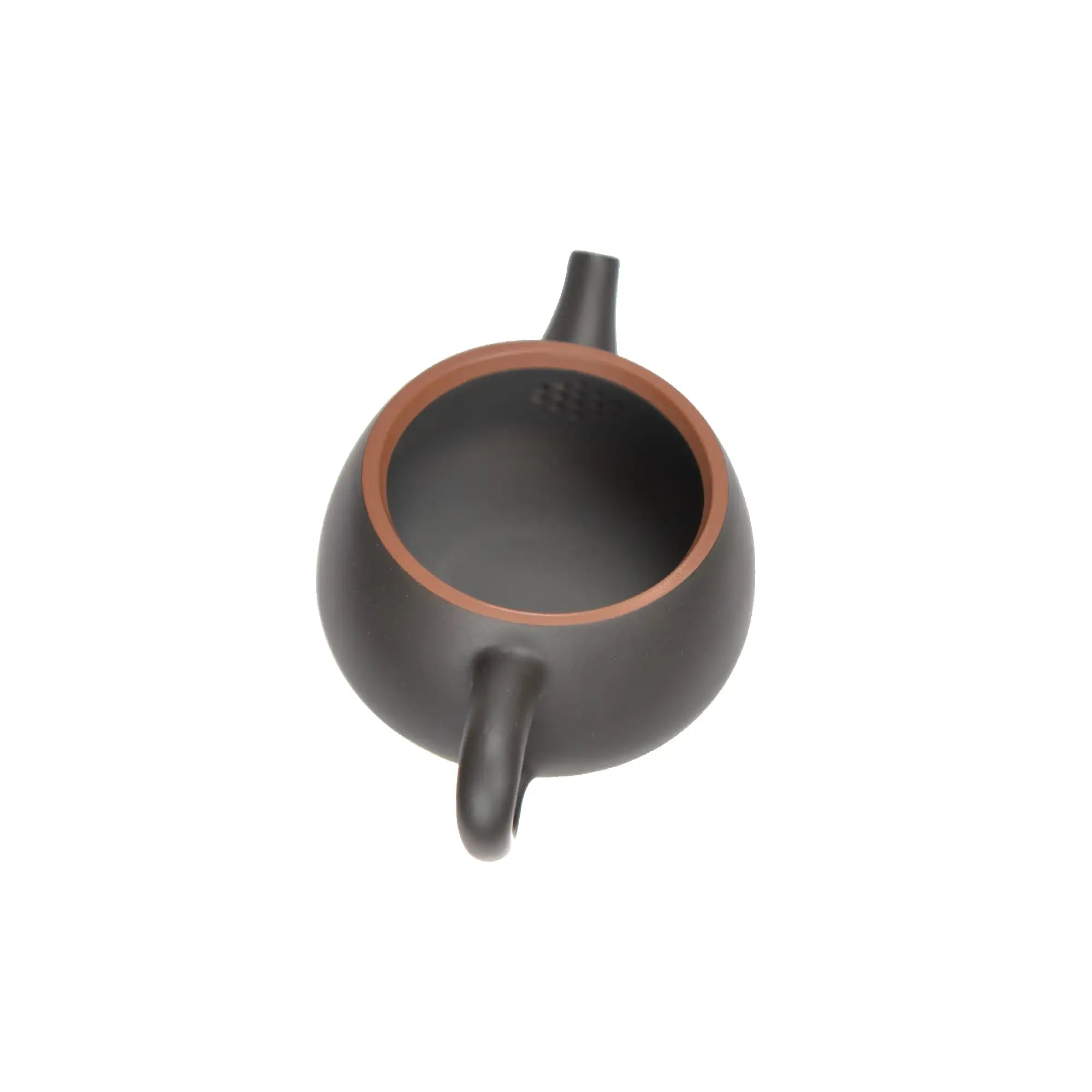 Open view of clay teapot showing natural clay interior and pouring structure