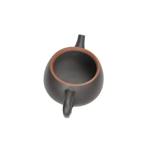 Open view of clay teapot showing natural clay interior and pouring structure