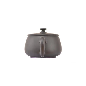 Back view of handcrafted clay teapot No.2 with clean uncarved design