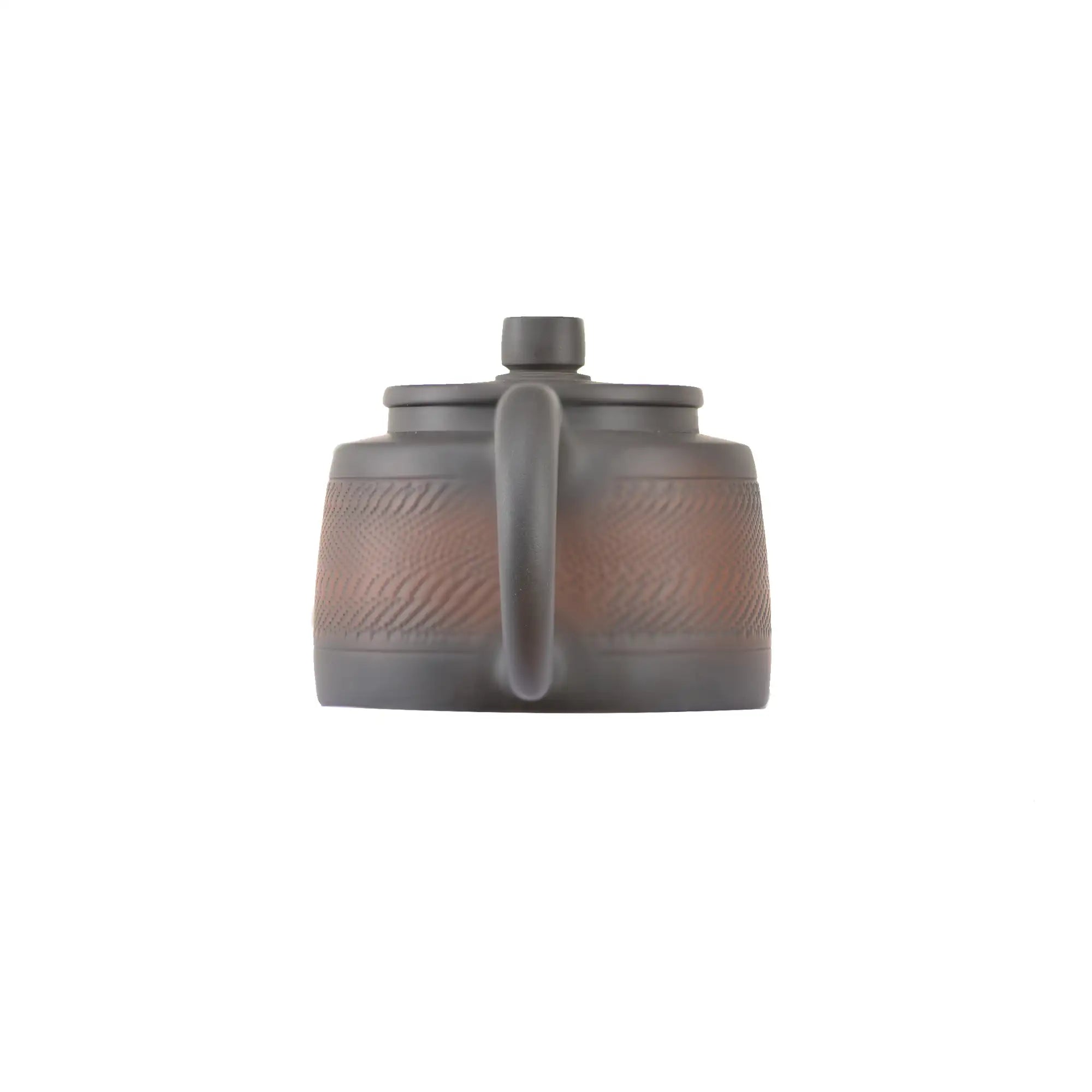 Back view of handcrafted clay teapot No.11 featuring natural textured surface