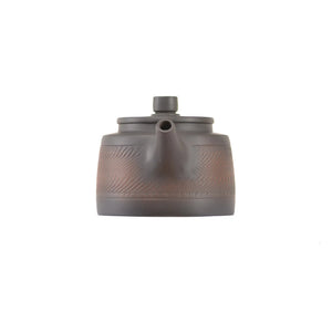 Handcrafted clay teapot No.11 featuring a jumping knife texture and unglazed finish