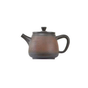 Side view of clay teapot No.12 showing handcrafted jumping knife texture