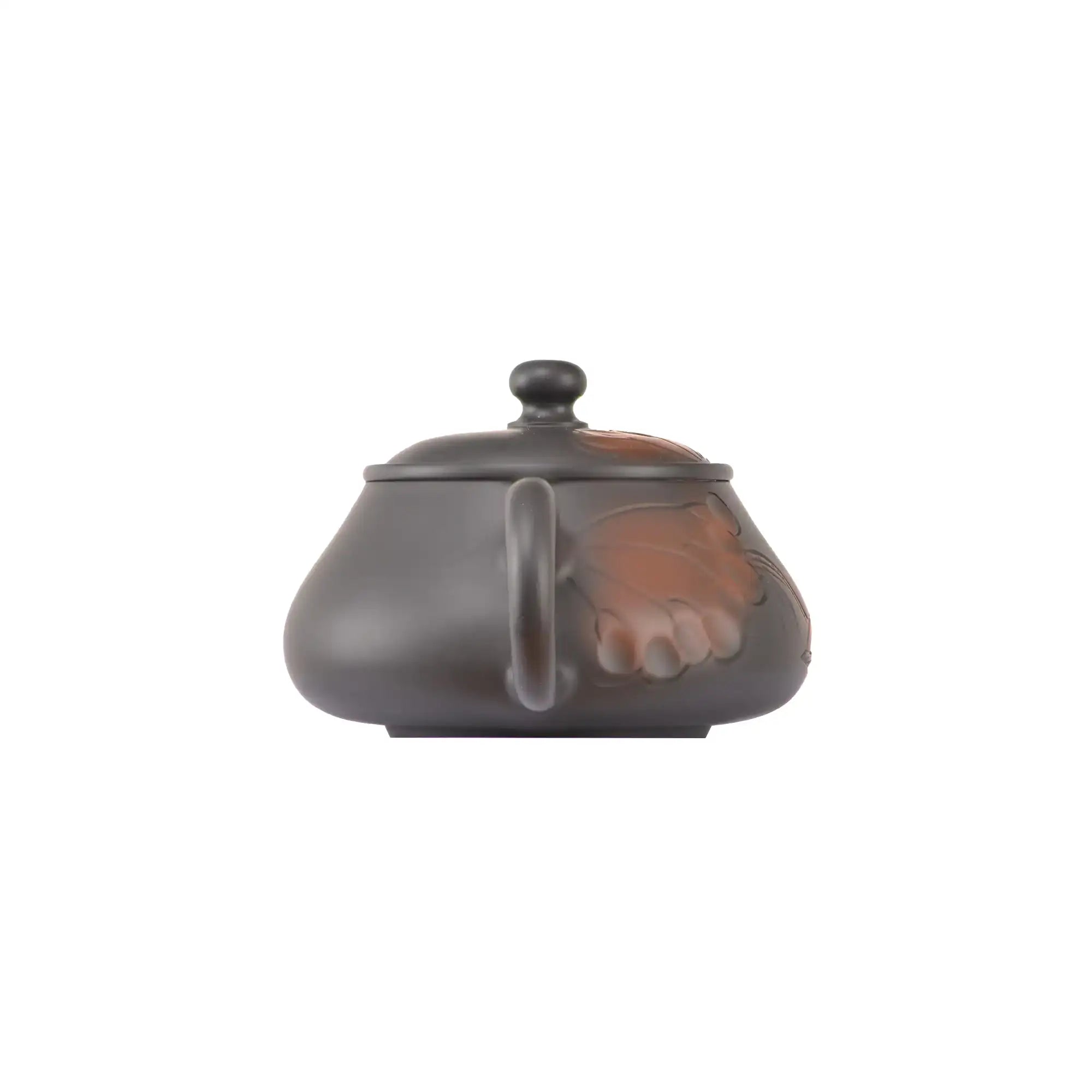Back view of handcrafted clay teapot No.5 with hand-carved lotus motif surface