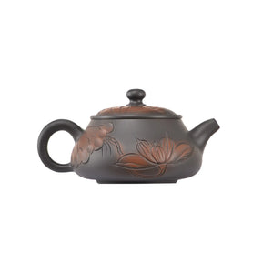 Handcrafted clay teapot No.5 featuring lotus carved detailing and an unglazed finish