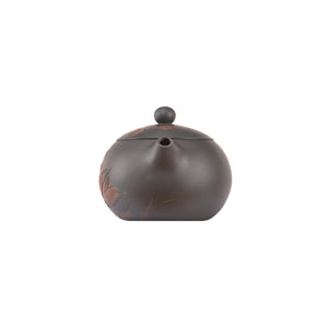 Front view of handcrafted clay teapot No.7 featuring lotus carved detailing and traditional rounded shape