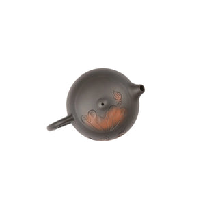 Top view of clay i teapot No.7 highlighting lid shape and lotus carved design