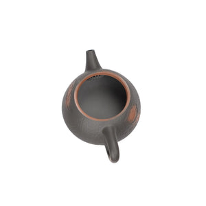Open view of clay teapot No.14 showing natural clay interior and pouring structure