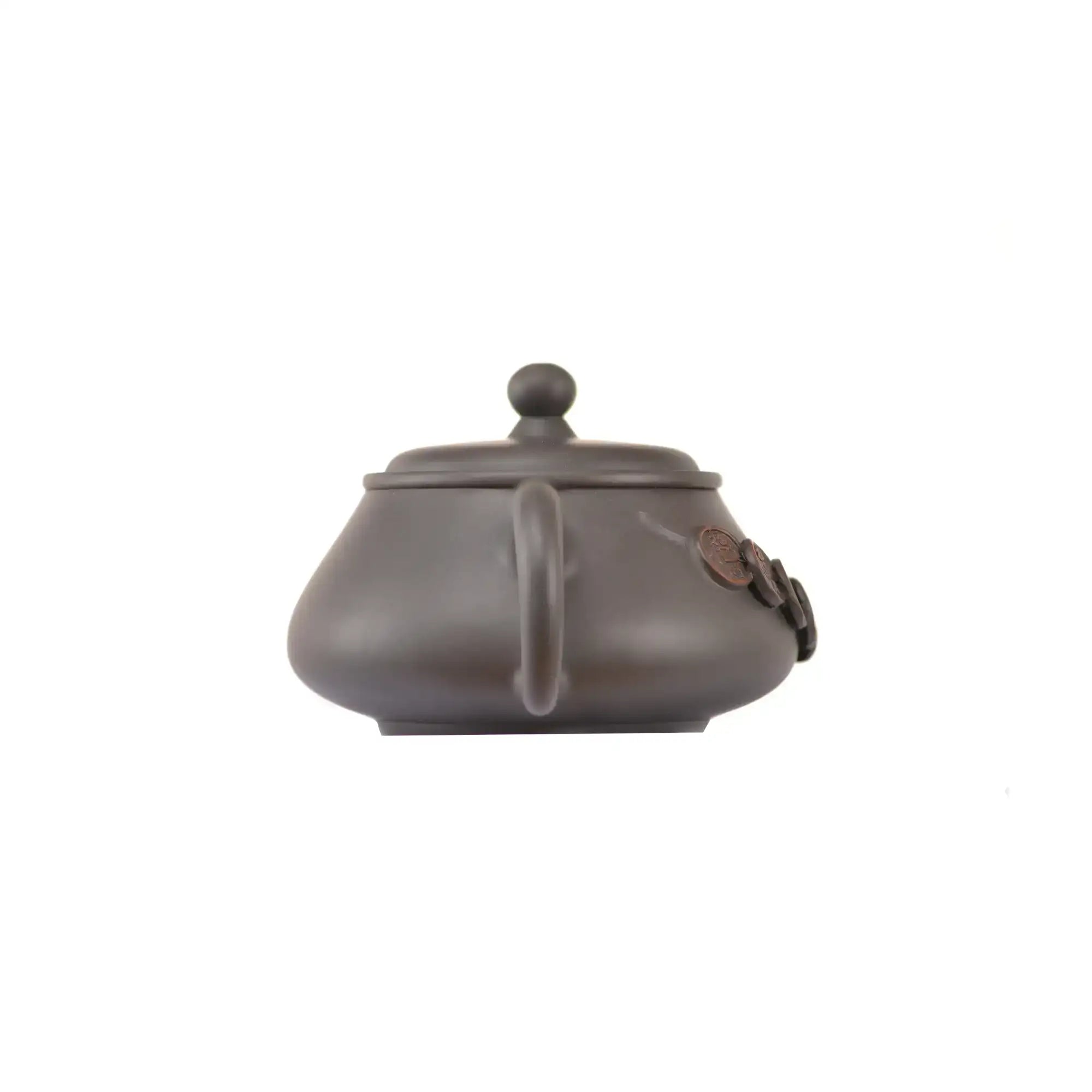 Back view of handcrafted clay teapot No.15 with smooth textured surface