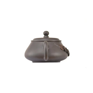 Back view of handcrafted clay teapot No.15 with smooth textured surface