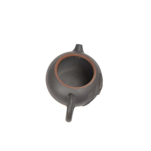 Open view of clay teapot No.16 showing natural clay interior and pouring structure