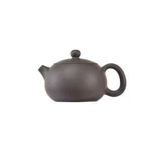 Side view of clay teapot No.16 with smooth uncarved surface and traditional form