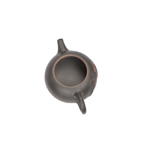 Open view of clay teapot No.17 showing natural clay interior and pouring structure