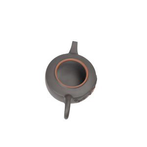 Open view of clay teapot No.18 showing natural clay interior and pouring structure