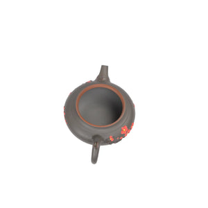 Open view of clay teapot No.19 showing natural clay interior and pouring structure