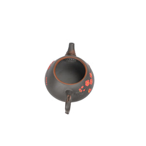 Open view of clay teapot No.20 showing natural clay interior and pouring structure