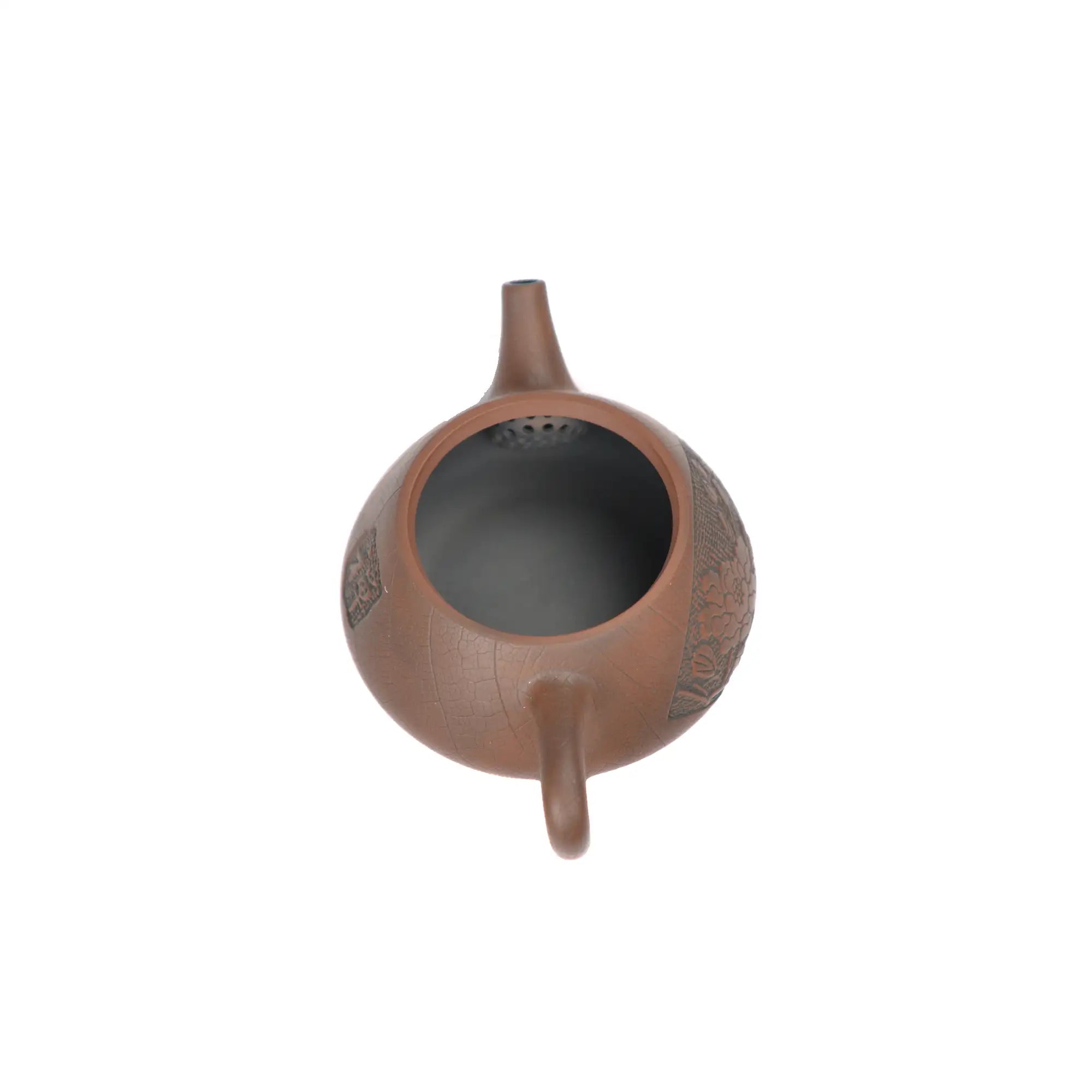 Open view of clay teapot No.24 showing natural clay interior and pouring structure