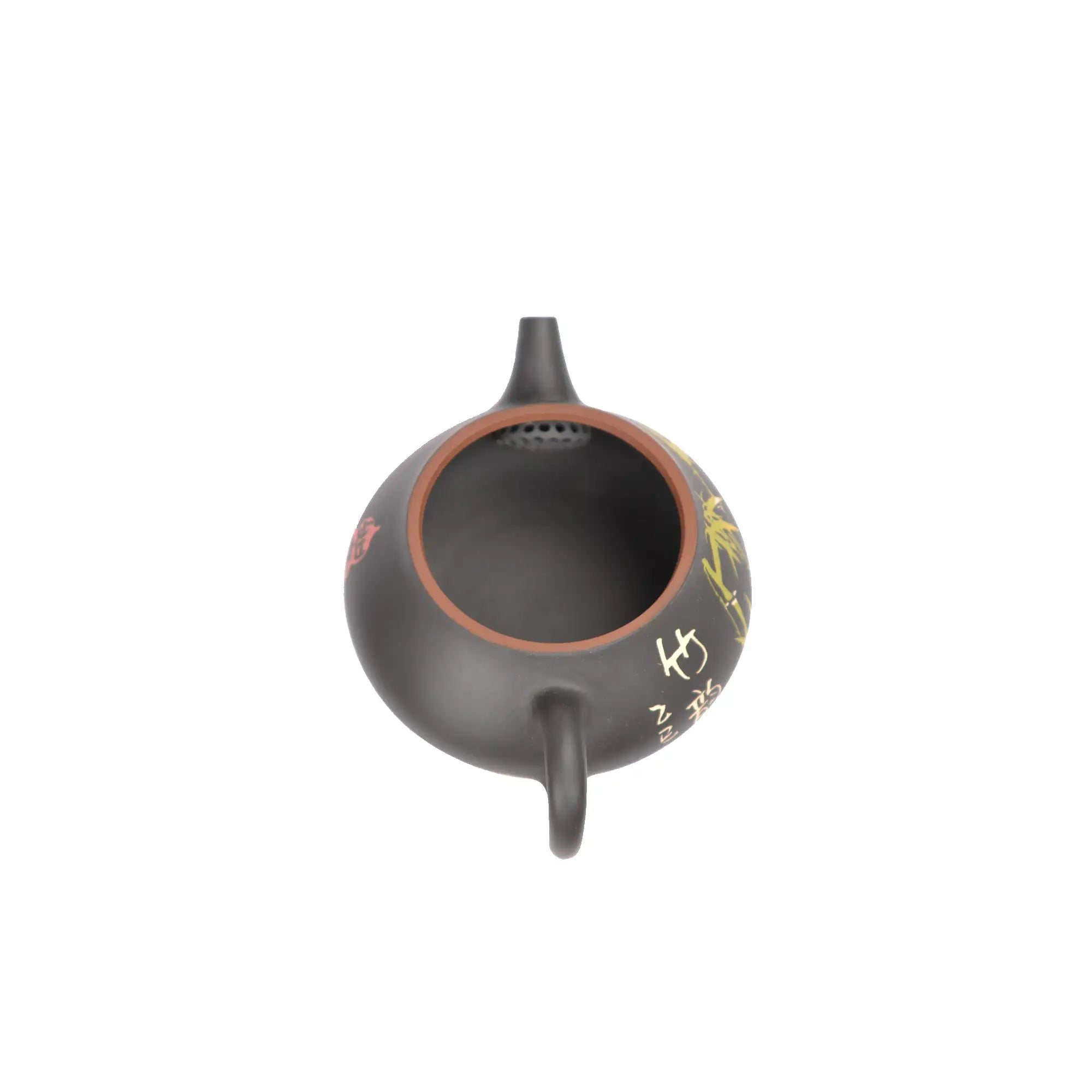 Open view of clay teapot No.26 showing natural clay interior and pouring
structure