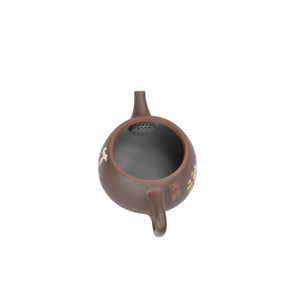 Open view of clay teapot No.28 showing natural clay interior and pouring structure