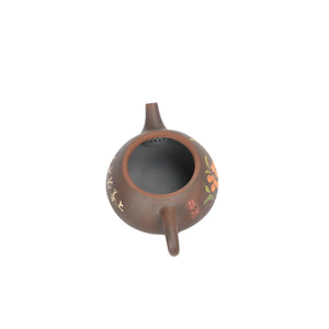 Open view of clay teapot No.29 showing natural clay interior and pouring structure