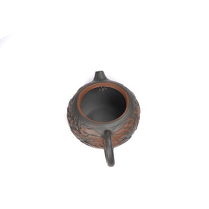 Open view of clay teapot No.30 showing natural clay interior and pouring structure