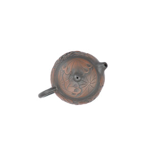 Top view of clay teapot No.30 highlighting lid shape and lotus carving detail