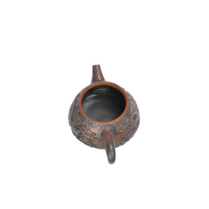 Open view of handcrafted clay teapot No.32 showing natural clay interior