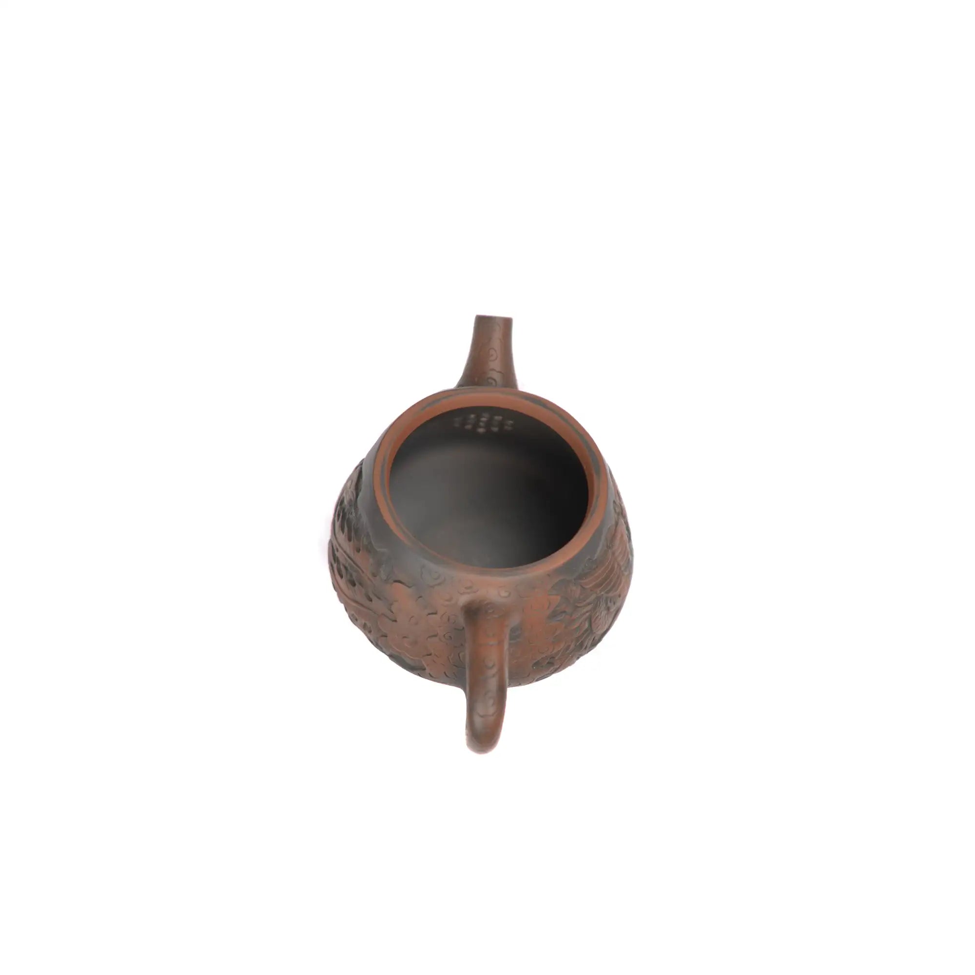 Interior view of PorSva No.34 Shipiao clay teapot displaying natural clay surface and pouring structure