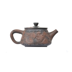 Right side view of PorSva No.34 Shipiao fully carved phoenix clay teapot showing continuous relief carving