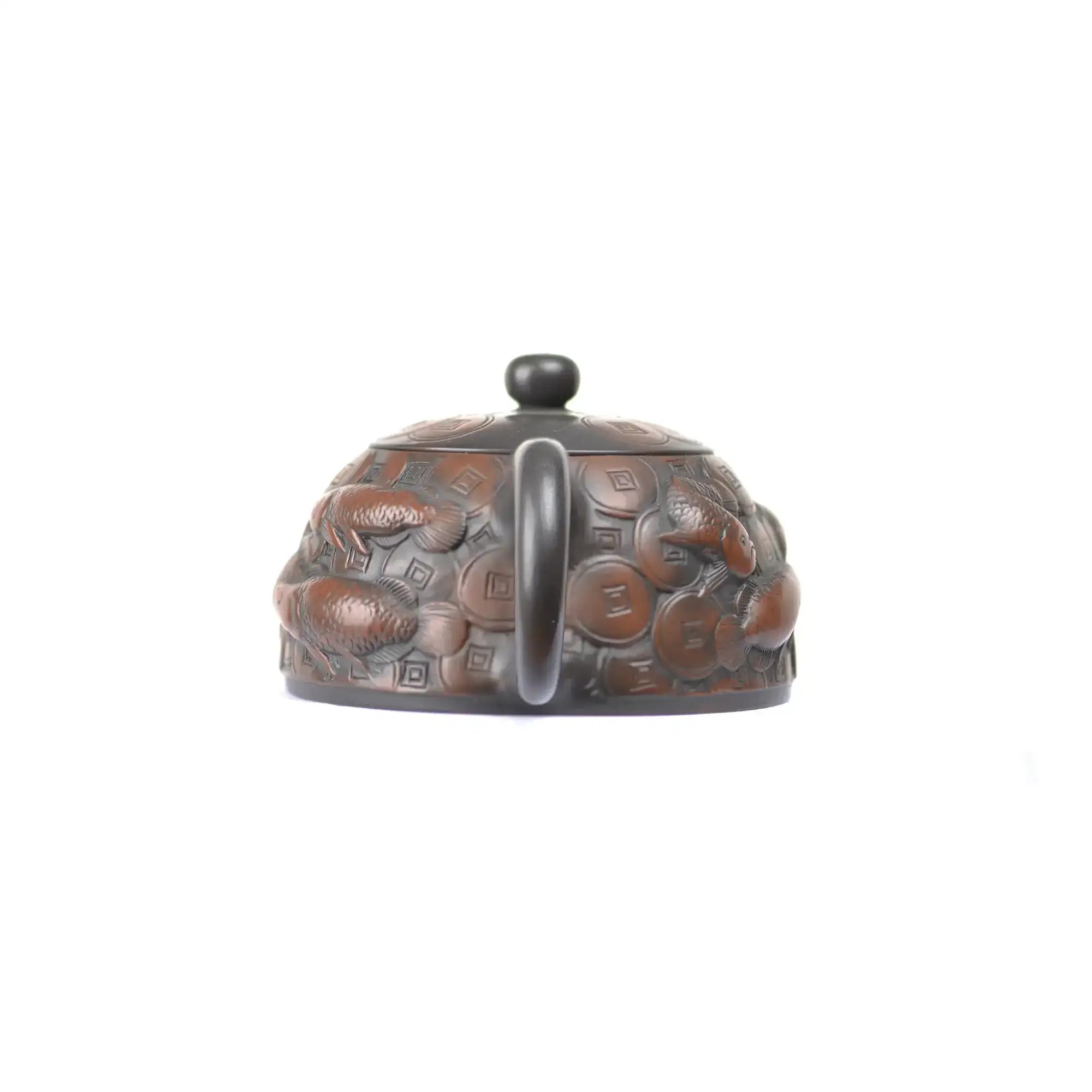 Back view of PorSva No.35 Shipiao coin and fish clay teapot featuring sculpted symbolic details