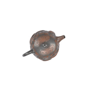 Top view of PorSva No.35 Shipiao coin and fish clay teapot showing carved lid and craftsmanship