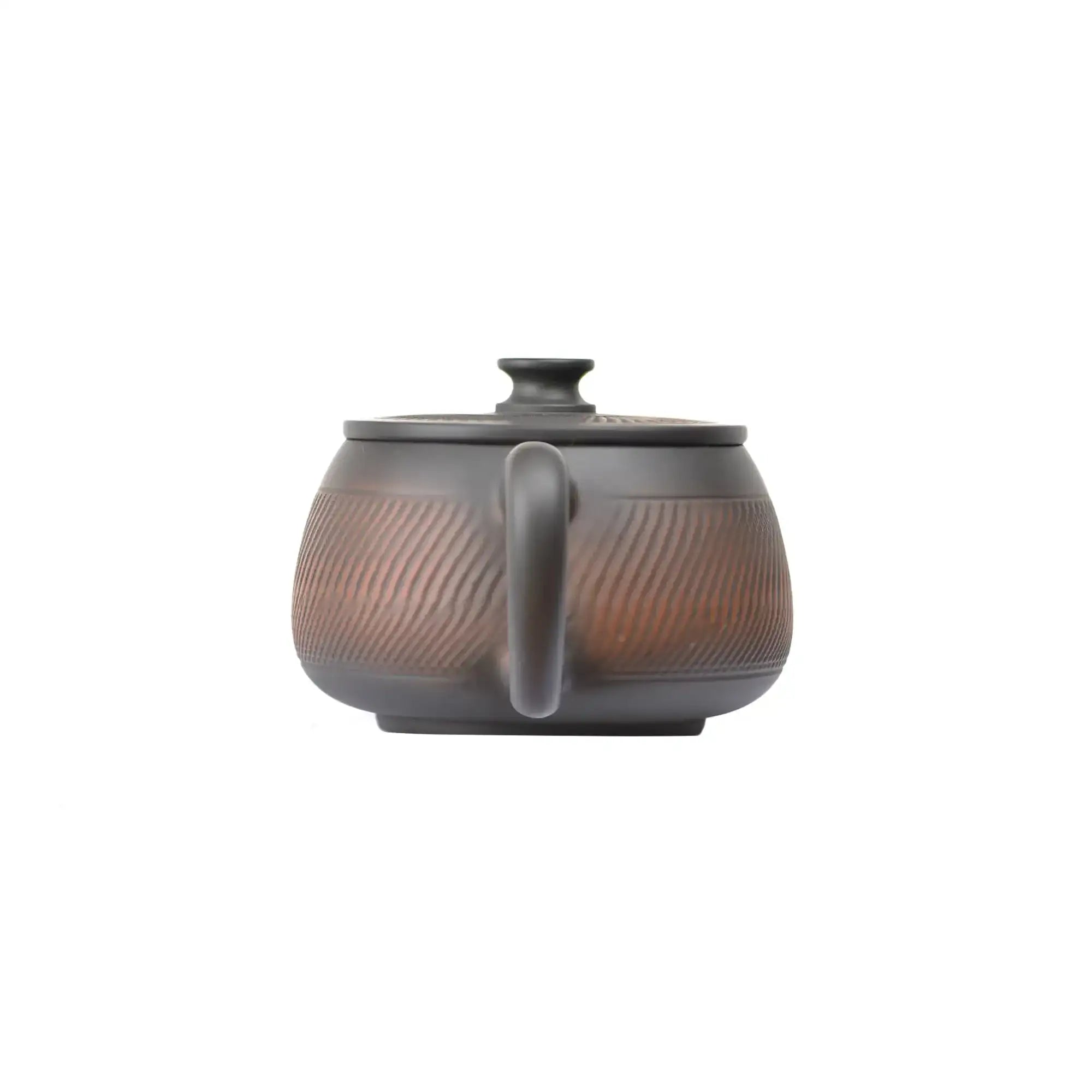 Back view of PorSva No.40 Hanwa chattering-knife texture clay teapot showing handcrafted surface