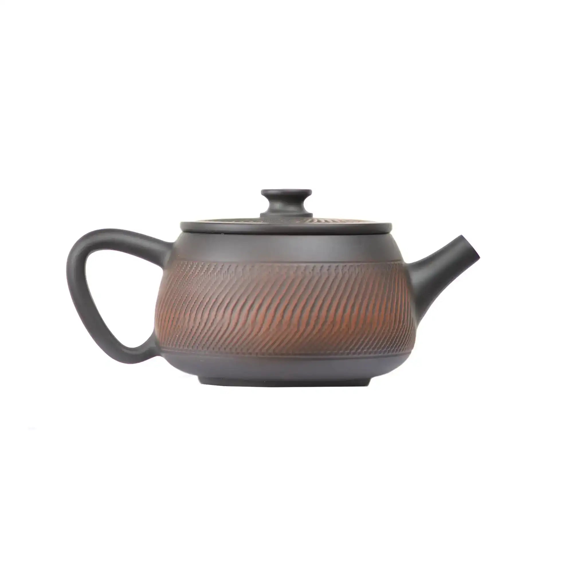 Right side view of PorSva No.40 Hanwa clay teapot highlighting textured carving pattern