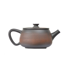 Right side view of PorSva No.40 Hanwa clay teapot highlighting textured carving pattern