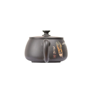 Back view of PorSva No.41 Hanwa landscape carved clay teapot highlighting engraved scenery motif