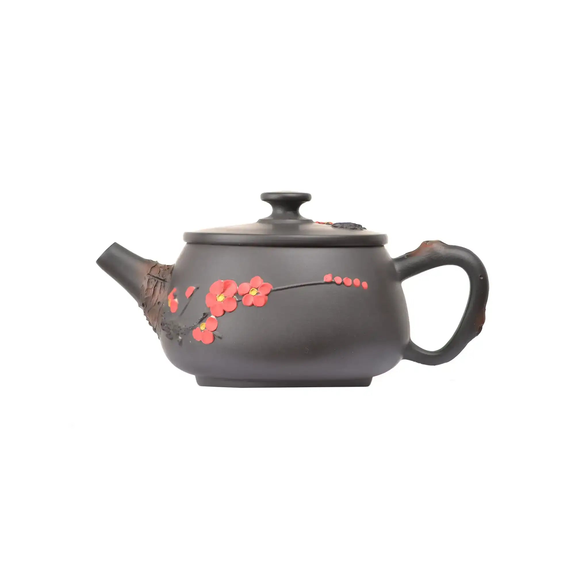 Handcrafted clay teapot with plum blossom design in root-inspired style, side view