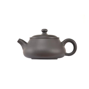 Side view of clay teapot No.5 with smooth uncarved surface and traditional form