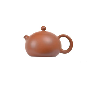 Left side view of PorSva No.50 plain red clay teapot highlighting smooth clay texture