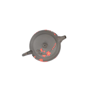 Top view of clay teapot No.19 highlighting lid shape and plum blossom root-art detail