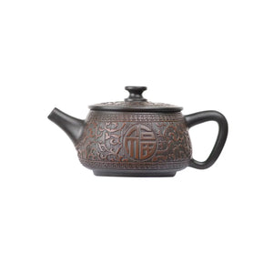 Left side view of PorSva No.36 Hanwa clay teapot featuring carved Chinese Fu character symbolizing good fortune