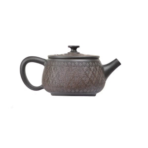 Right side view of PorSva No.38 Hanwa machine-carved pattern clay teapot showing structured architectural form