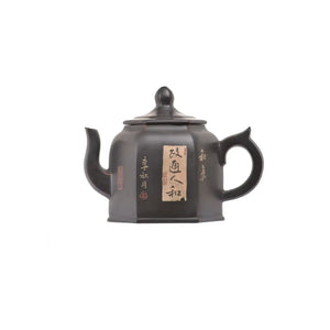 Left side view of PorSva No.57 hexagonal clay teapot featuring carved Chinese calligraphy with clay inlay