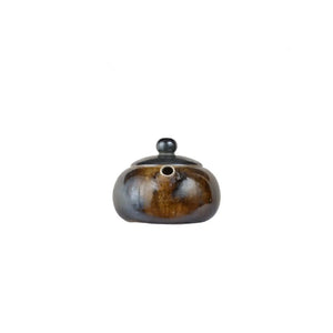 Front view of PorSva No.60 wood-fired clay teapot showing natural kiln firing marks