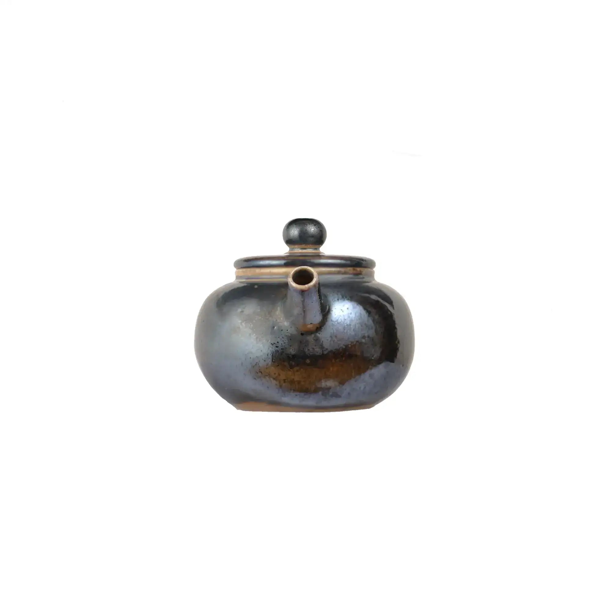 Front view of PorSva No.62 wood-fired clay teapot showing natural kiln firing marks