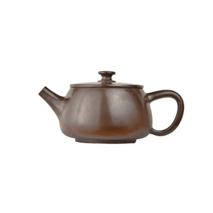 Left side view of PorSva No.44 wood-fired clay teapot showing natural kiln ash texture