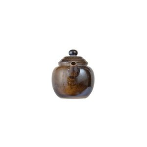 Front view of PorSva No.65 wood-fired clay teapot showing natural kiln firing marks